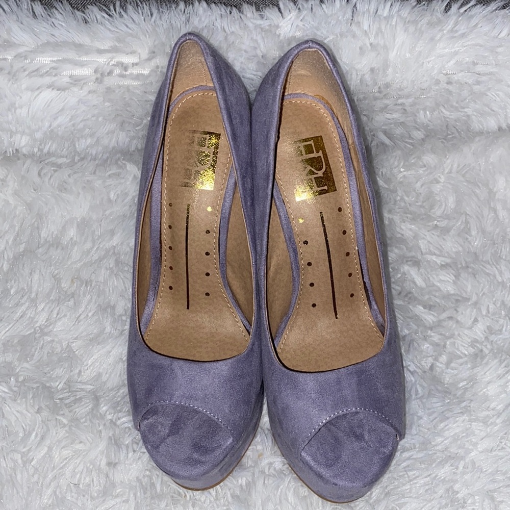 Lavender wedge only worn one 5 inch tall. Peep toe